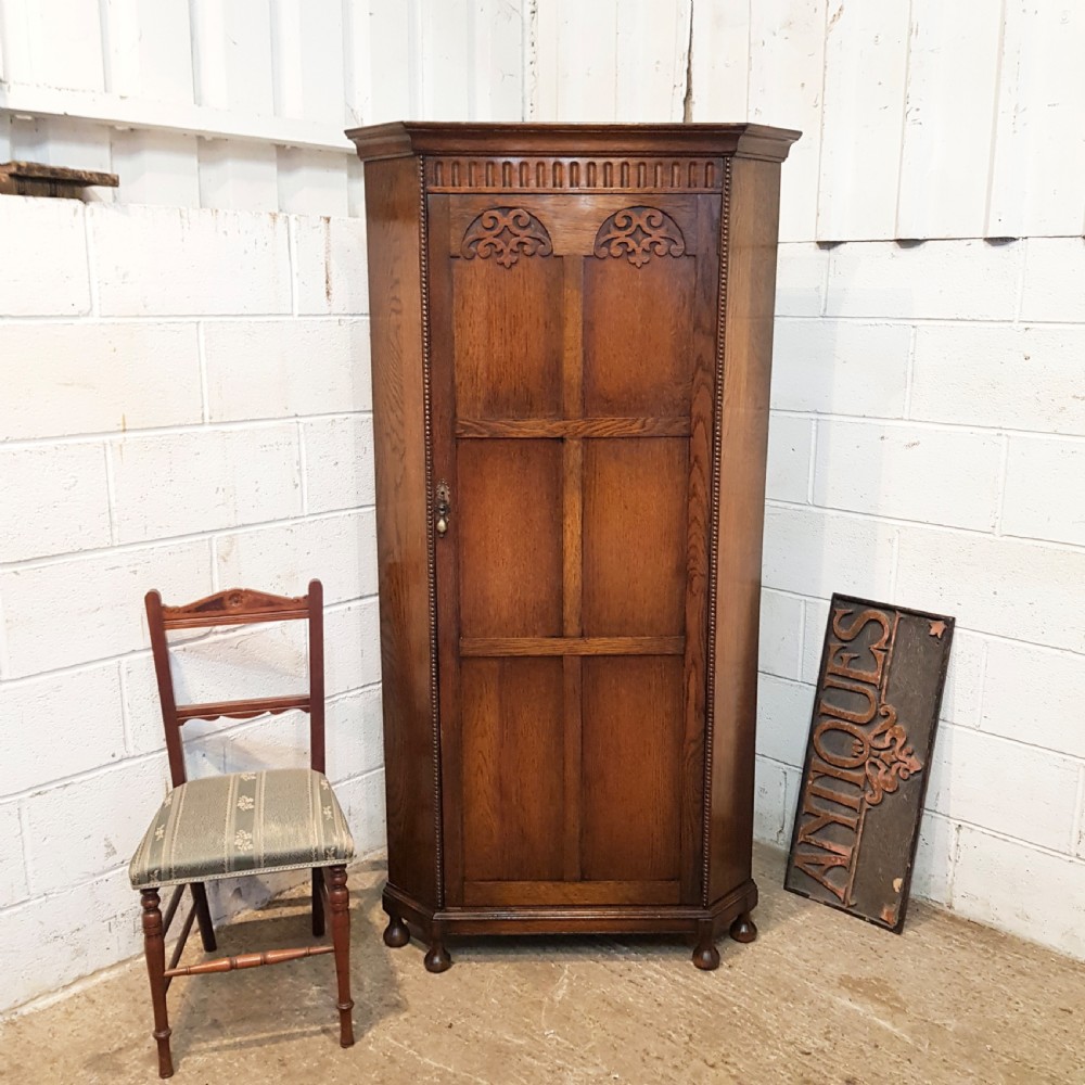 antique carved oak corner wardrobe c1920