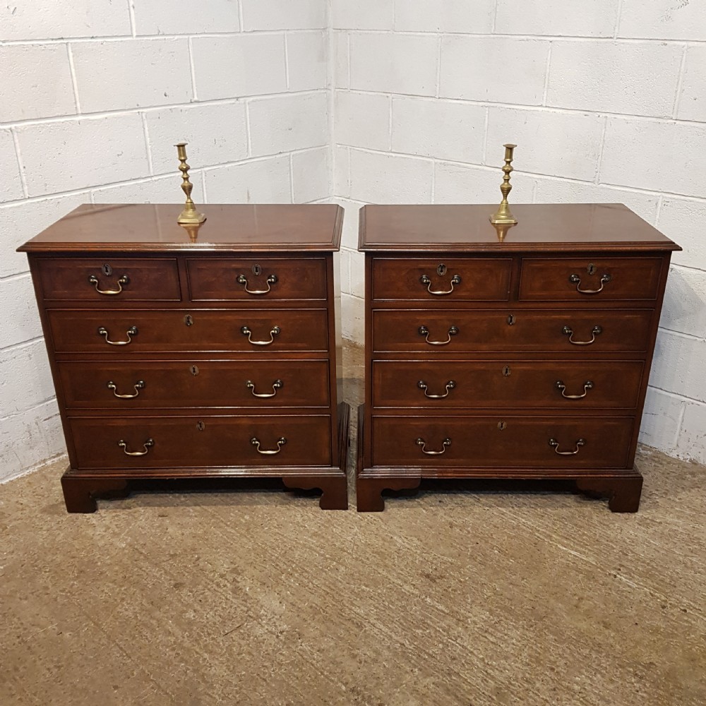 an antique pair of 1920's four height burr walnut chest of drawers