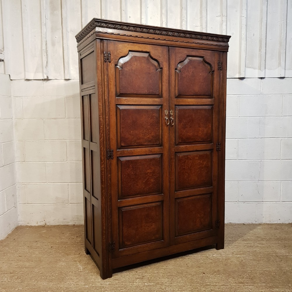 an antique oak and walnut double wardrobe c1910