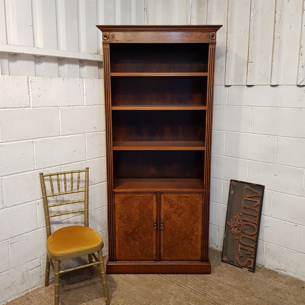an antique walnut tall narrow open bookcase or cupboard c1920