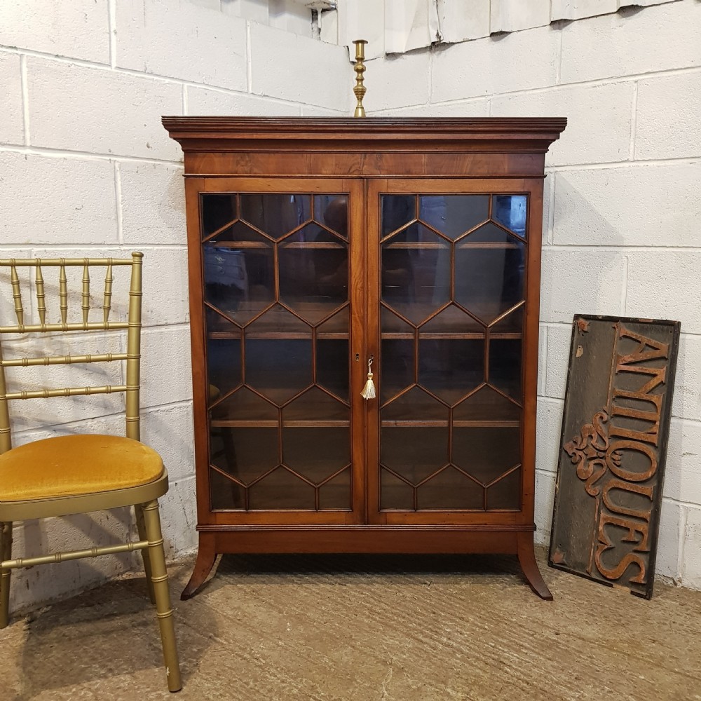 an antique regency mahogany astrical glazed bookcase c1810