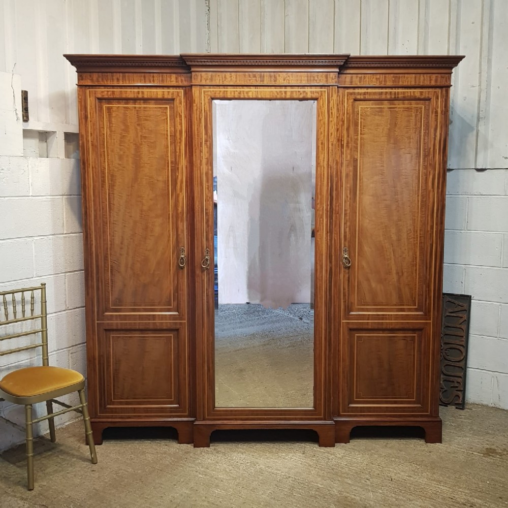 an antique edwardian mahogany breakfront triple wardrobe c1890