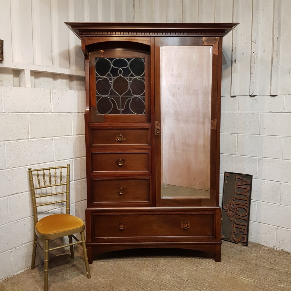 an antique arts crafts mahogany combination wardrobe c1900