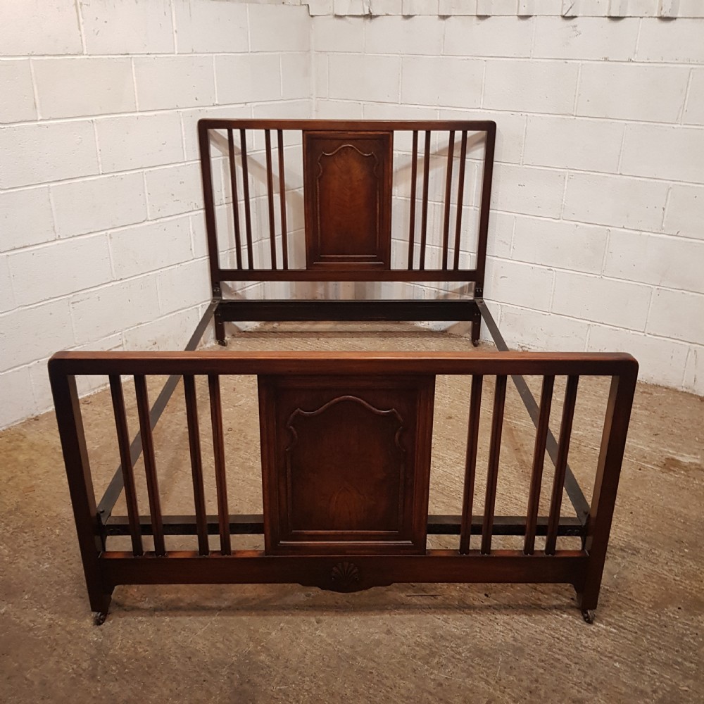 an antique walnut double bedstead c1920
