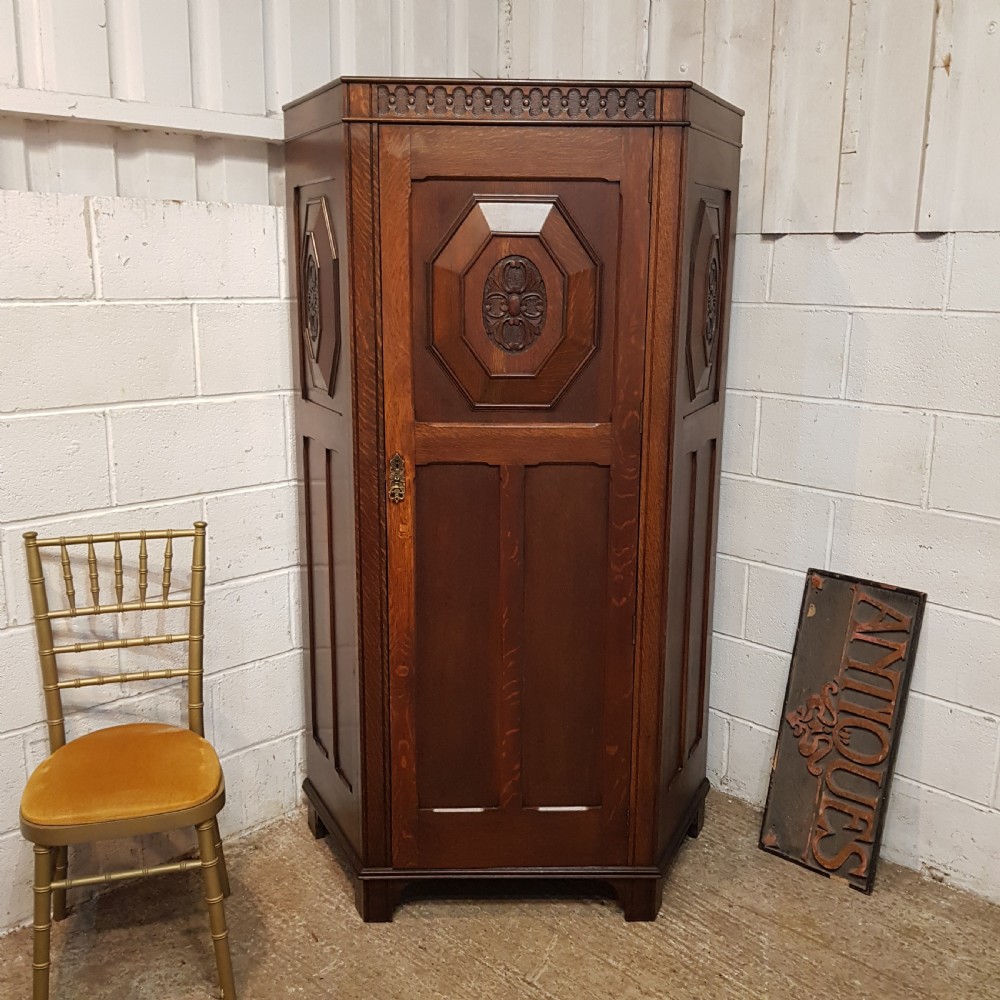 an antique oak hall wardrobe c1920