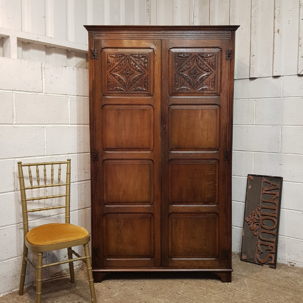 an antique double oak wardrobe c1920