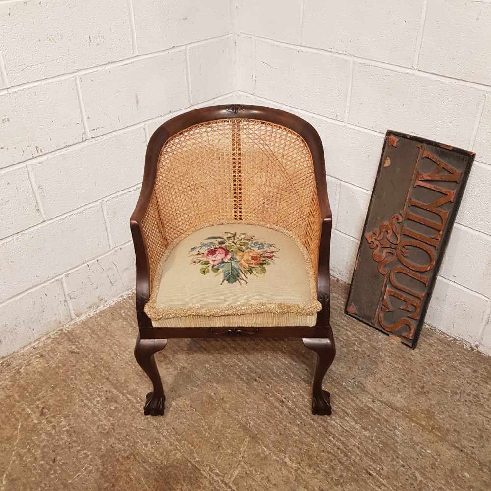 A DENBY SPINKS MAHOGANY FRAMED BERGERE BACKED TUB CHAIR C1920 a denby spinks mahogany framed bergere backed tub chair c1920