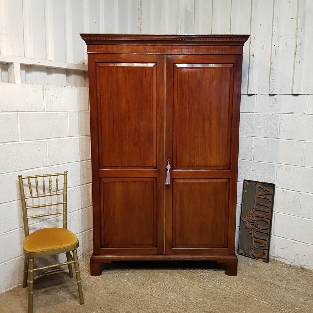 an antique regency mahogany double wardrobe c1810