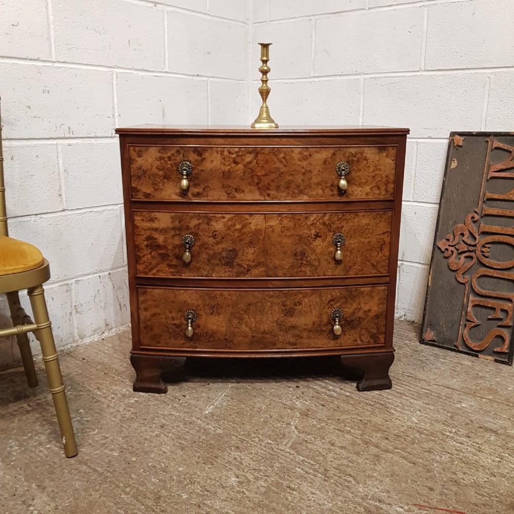 A WALNUT BOW FRONTED 3 HEIGHT CHEST C1920 a walnut bow fronted 3 height chest c1920