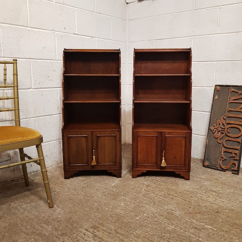 a pair of edwardian mahogany small open waterfall bookcases c1900