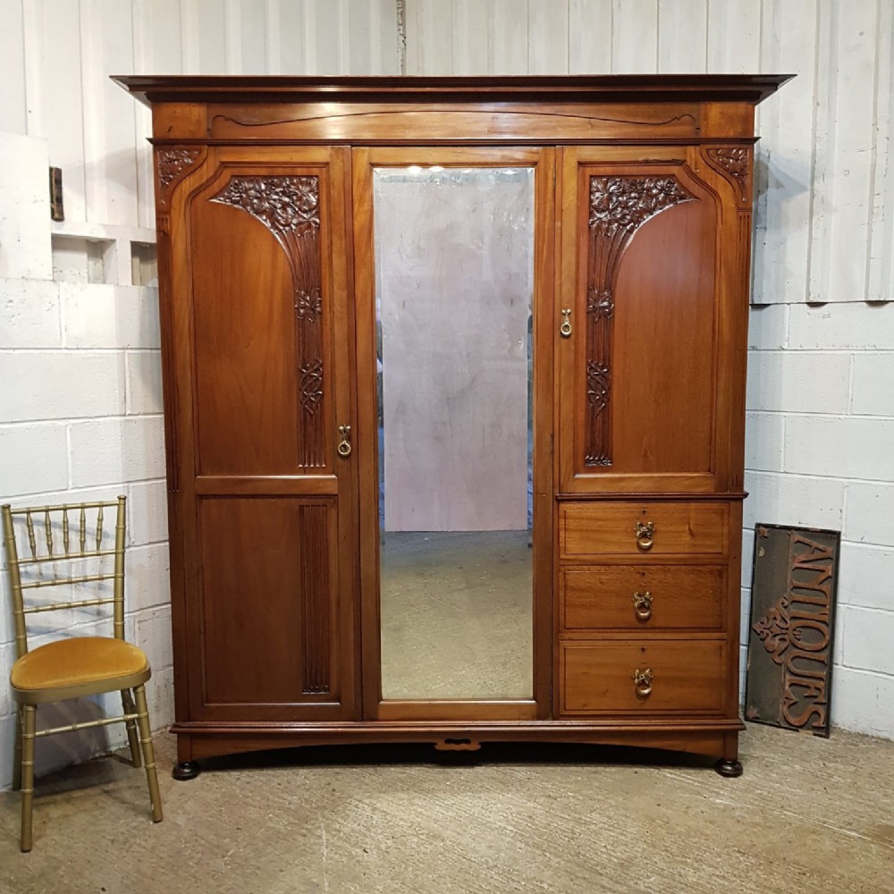 an art nouveau mahogany triple wardrobe c1900