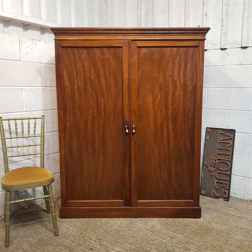 a regency mahogany three quarter height double wardrobe c1810