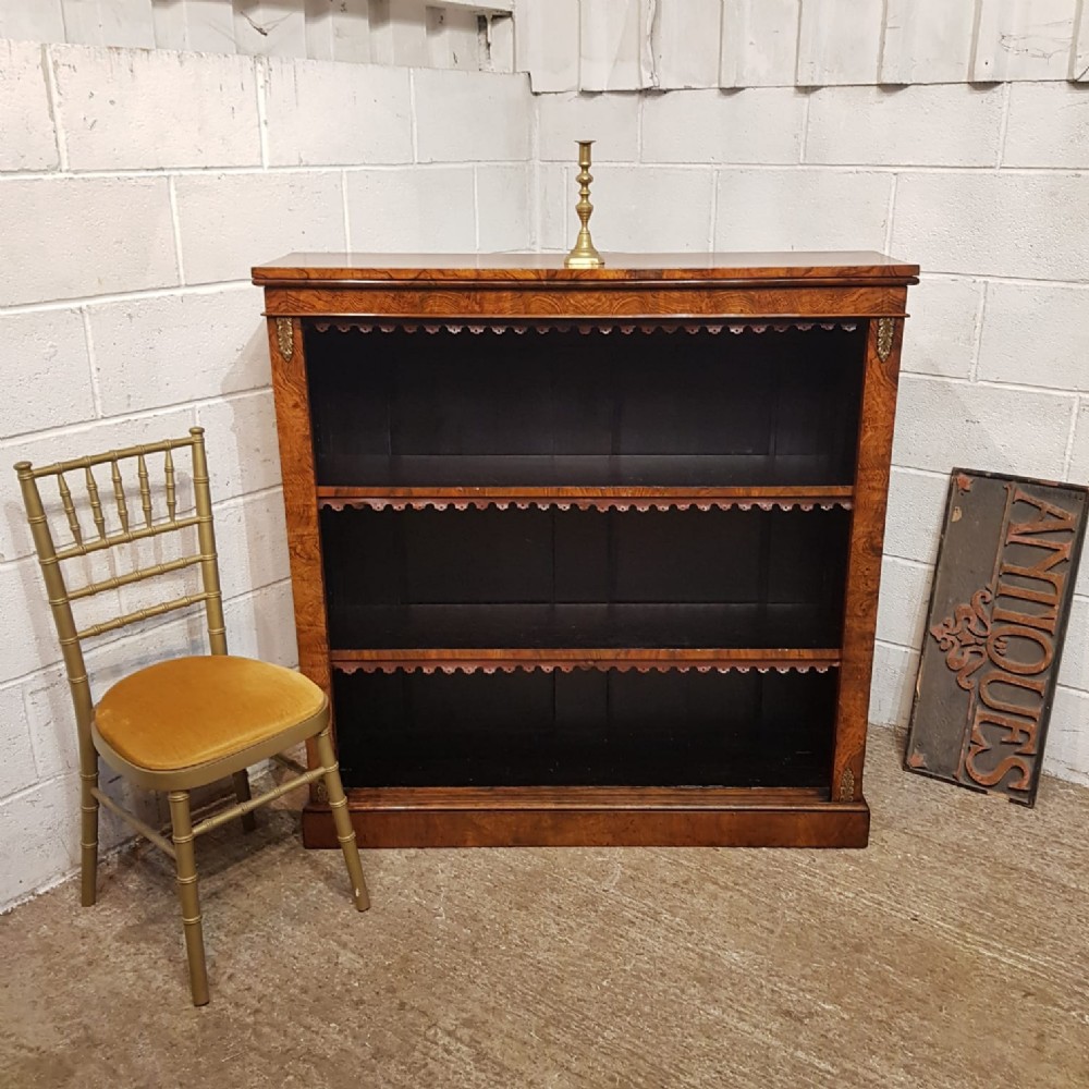 a victorian burr walnut open bookcase c1880