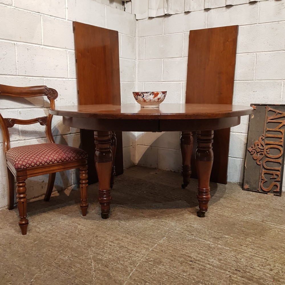a victorian walnut pull out extending dining table with two extra leaves c1890