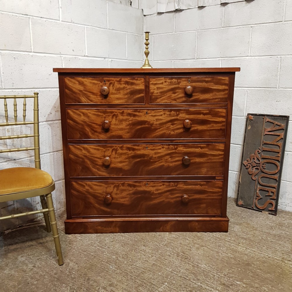 a victorian flame mahogany 4 height chest of drawers c1860
