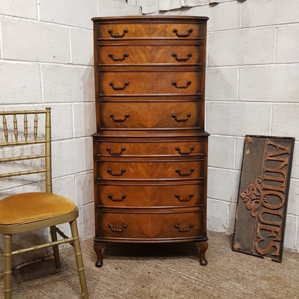 a bow fronted walnut chest on chest c1920