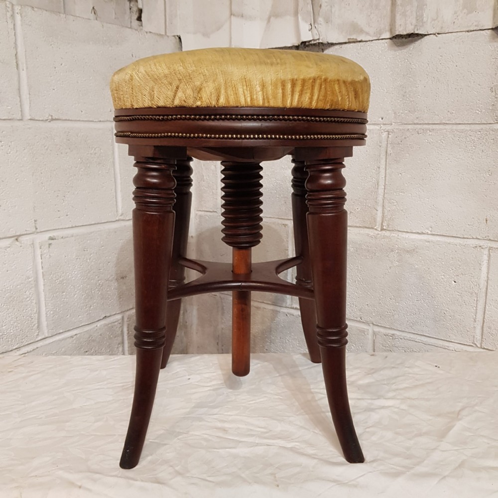 a revolving victorian mahogany piano stool c1880