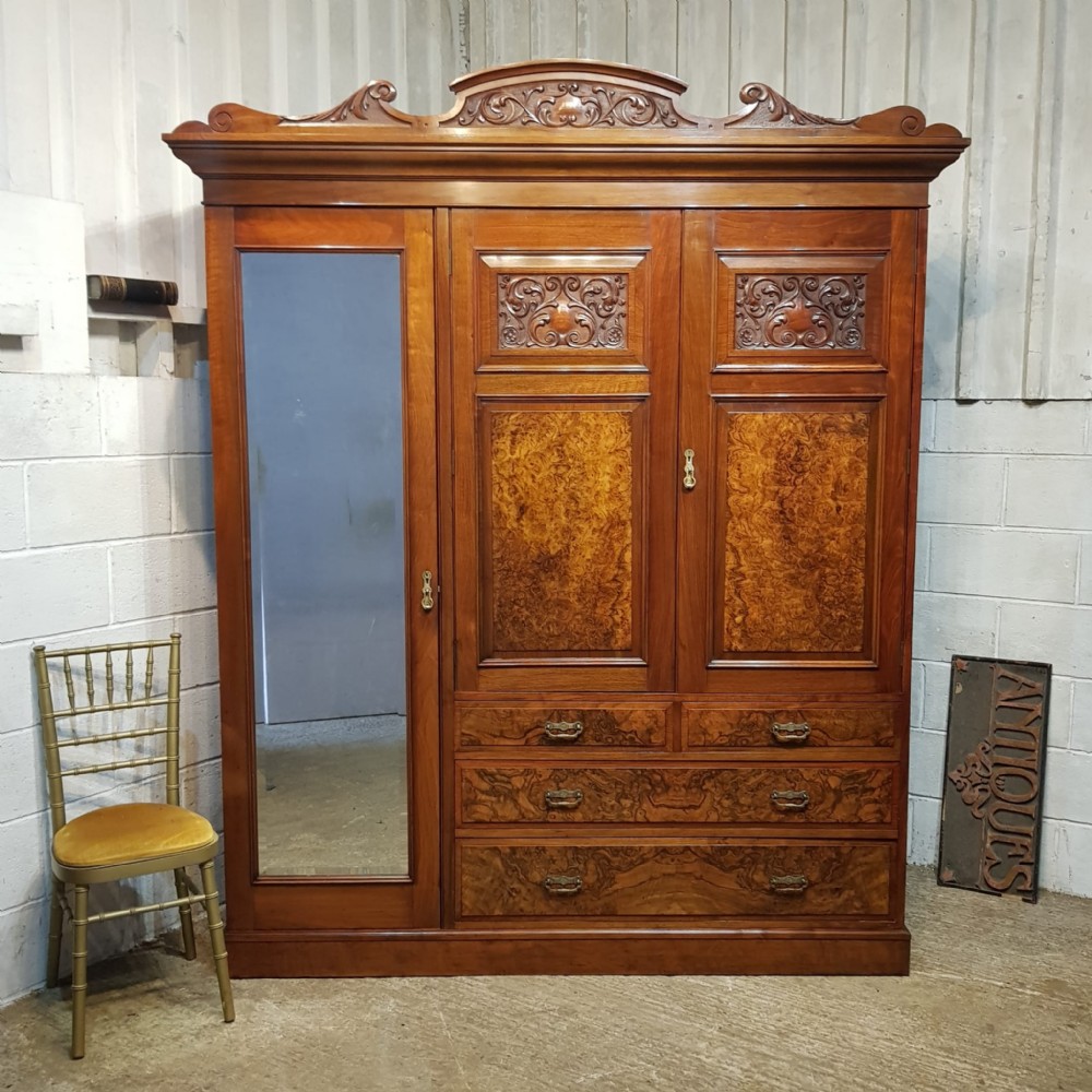 a walnut and burr walnut compactum triple wardrobe c1890
