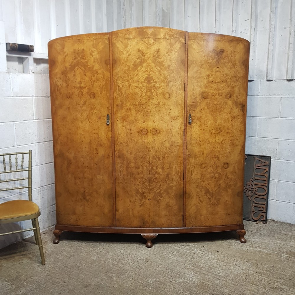 a burr walnut art deco bow fronted triple wardrobe c1920