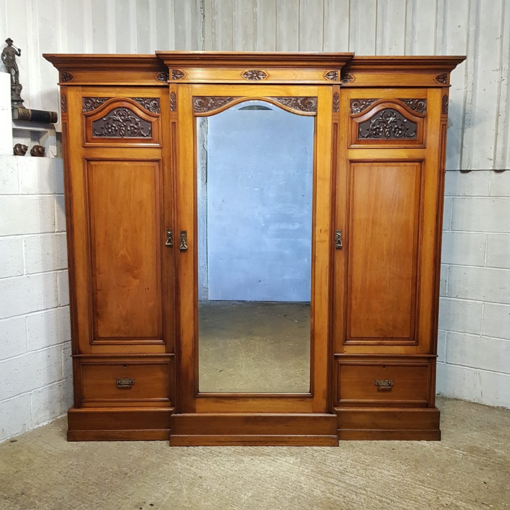 a late victorian walnut breakfront triple wardrobe c1890