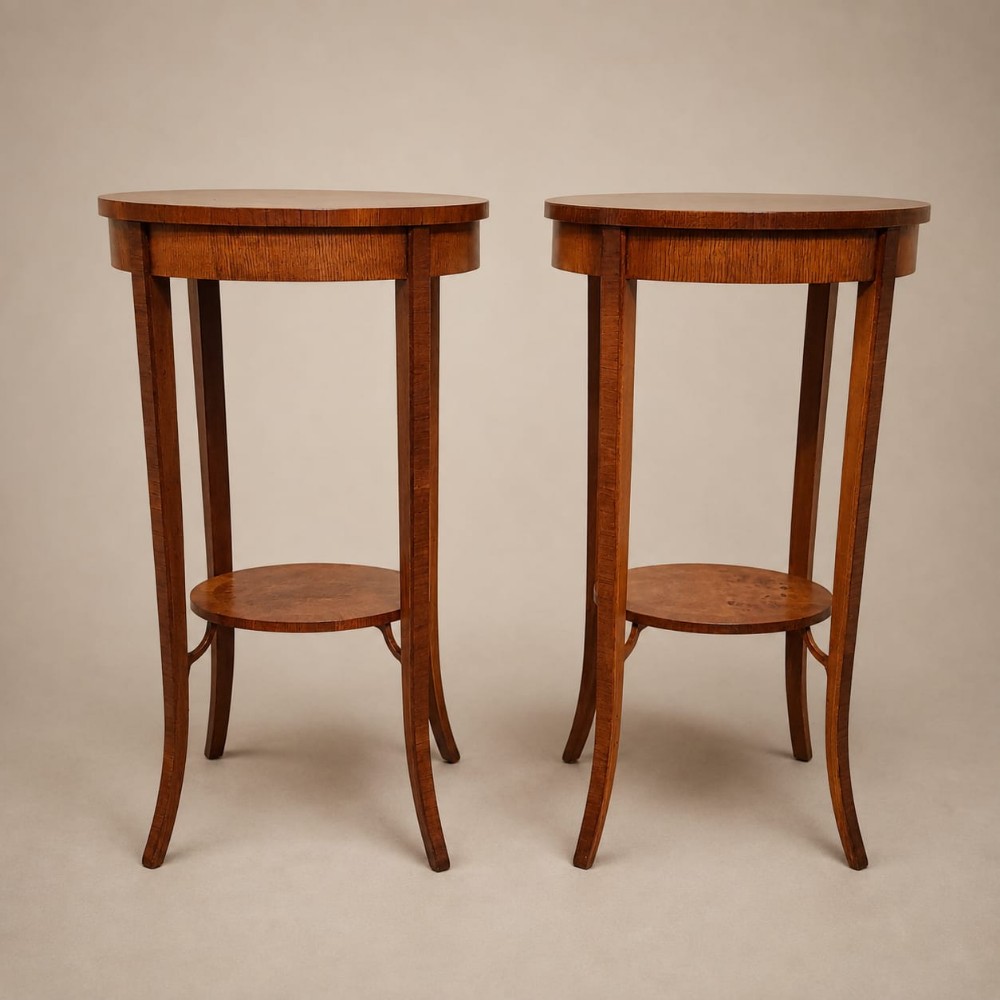 a pair of oval walnut side lamp tables c1920