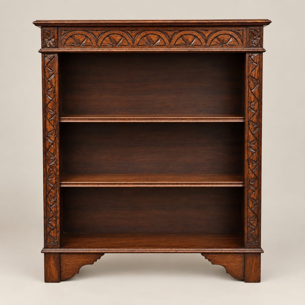 a carved oak open bookcase c1920