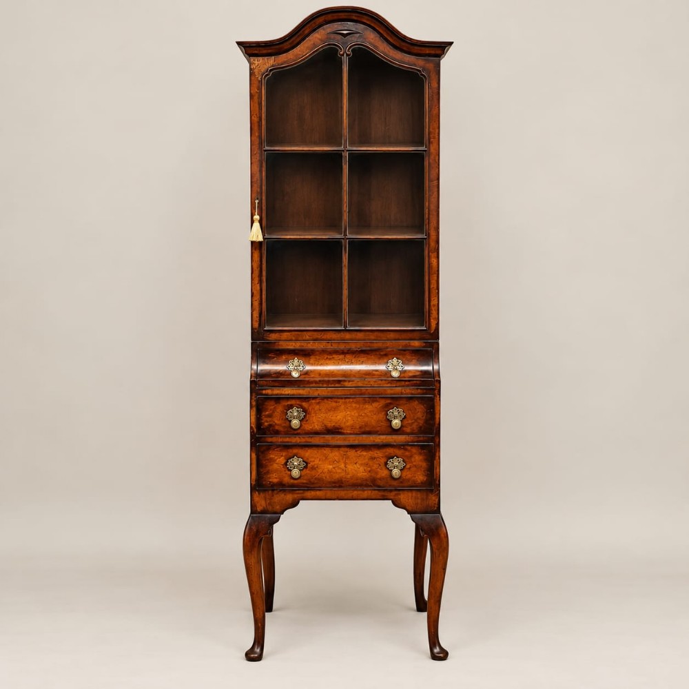 a tall narrow burr walnut bookcase cabinet c1920